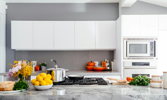 A clean modern kitchen counter with cooking gear laid out