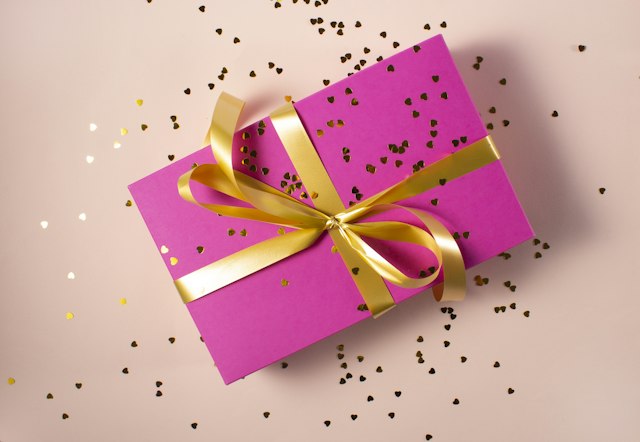 A wrapped gift box with ribbon — a care package on its way